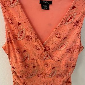 Sleeveless peach colored V neck top with rouching